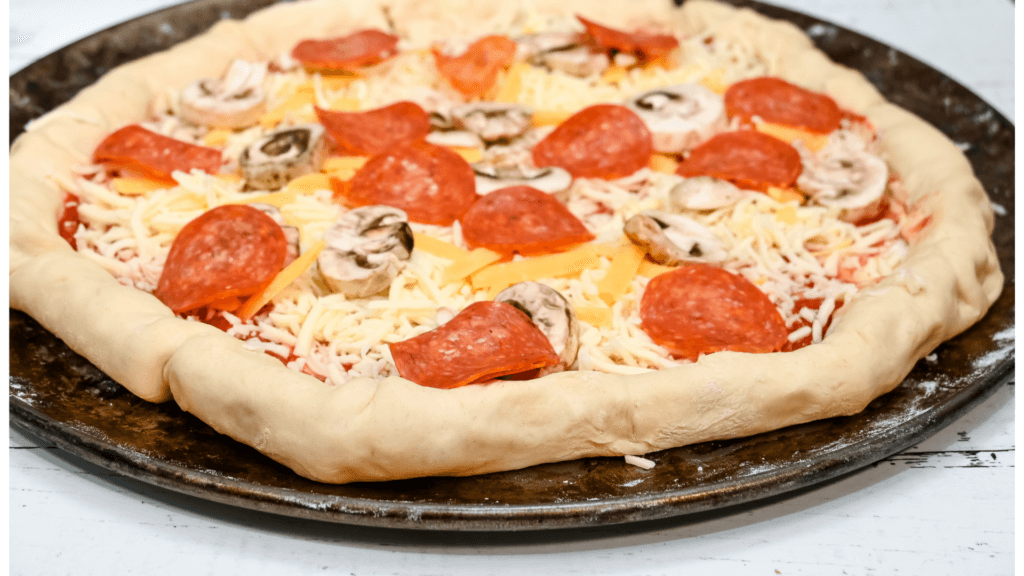 A finished stuffed crust pizza ready to go in the oven