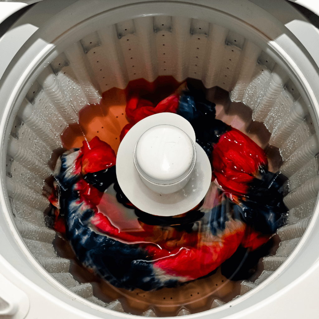 The tie dye dress in a washing machine. 
