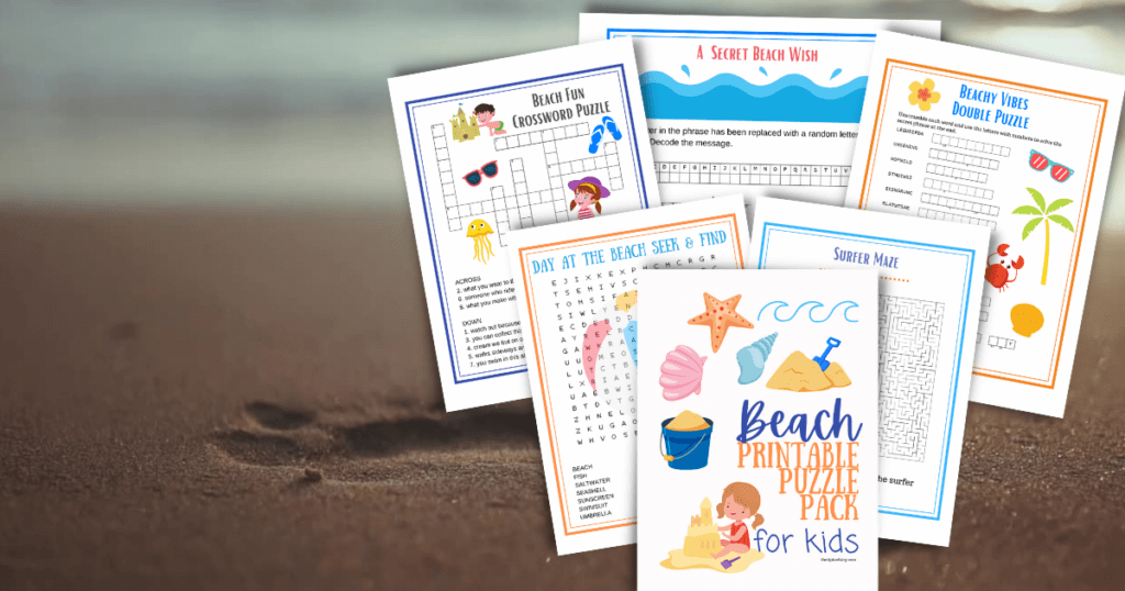 Close up image of the free kids beach printable puzzles on a sandy beach with a footprint. 