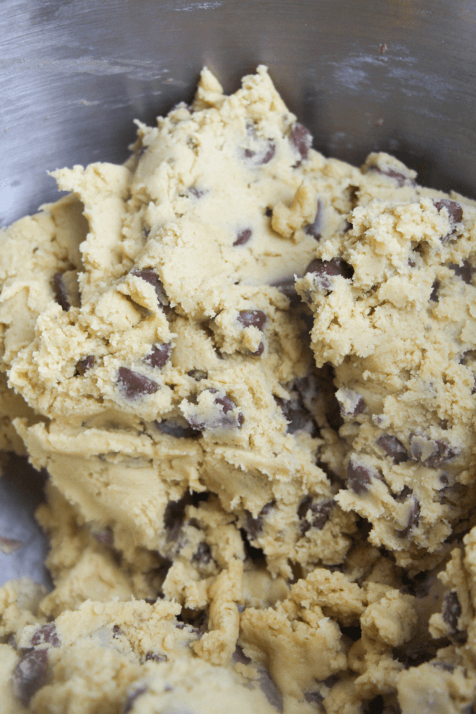 mixing in the chocolate chips for the giant chocolate chip cookie dough