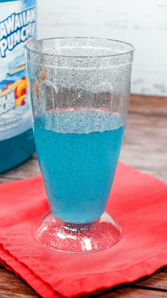 Blue Hawaiian Punch in a glitter glass. 