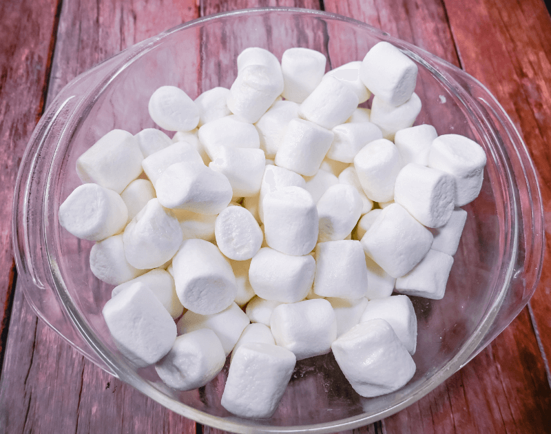 A glass bowl of melted butter and marshmallows. 