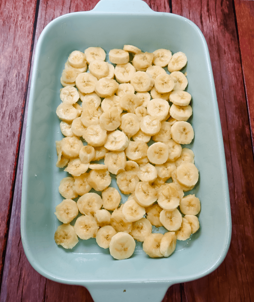 Sliced bananas in a light blue casserole dish