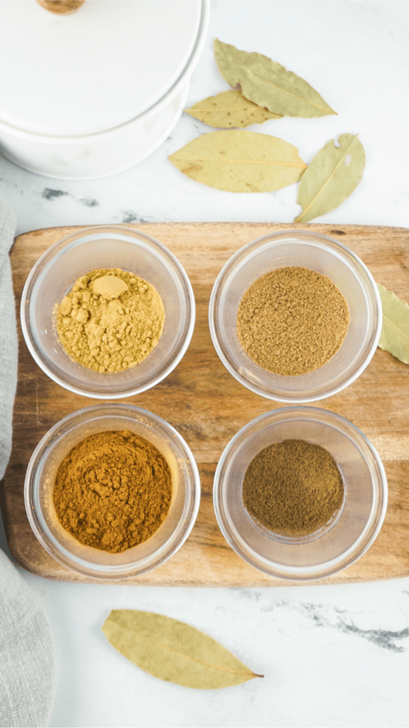 Individual glass bowls of the spices to make pumpkin pie spice