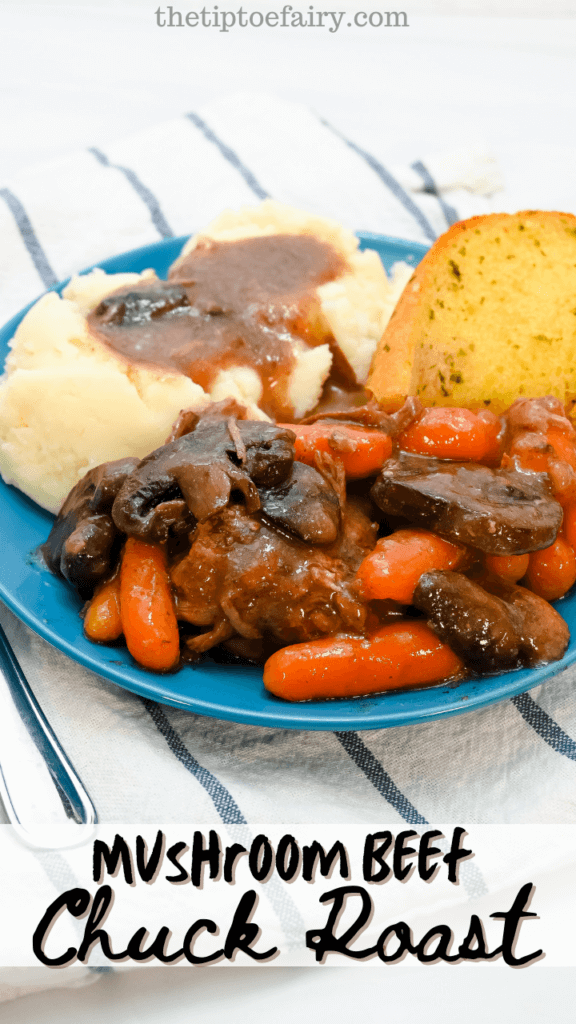 Close up image of a blue plate with mushroom beef chuck roast, mashed potatoes, and garlic bread