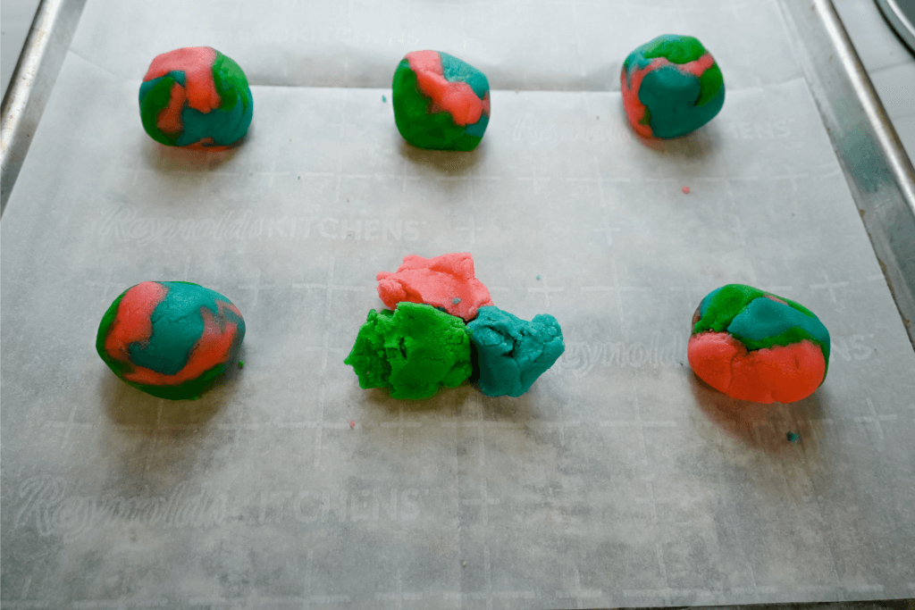 Mixing the colored cookie dough into balls