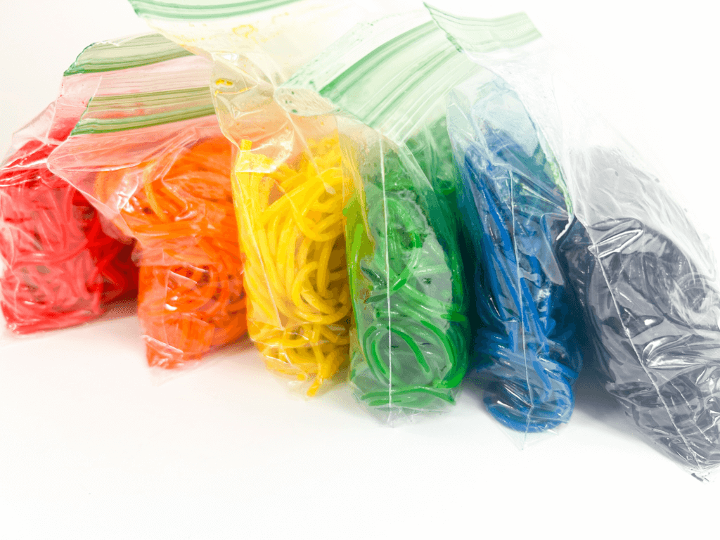 ziplock bags of rainbow spaghetti in six colors