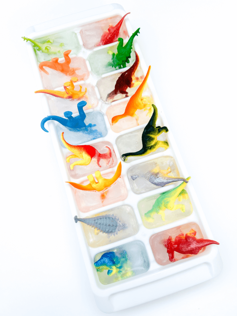 Dinosaurs frozen in water in ice cube trays