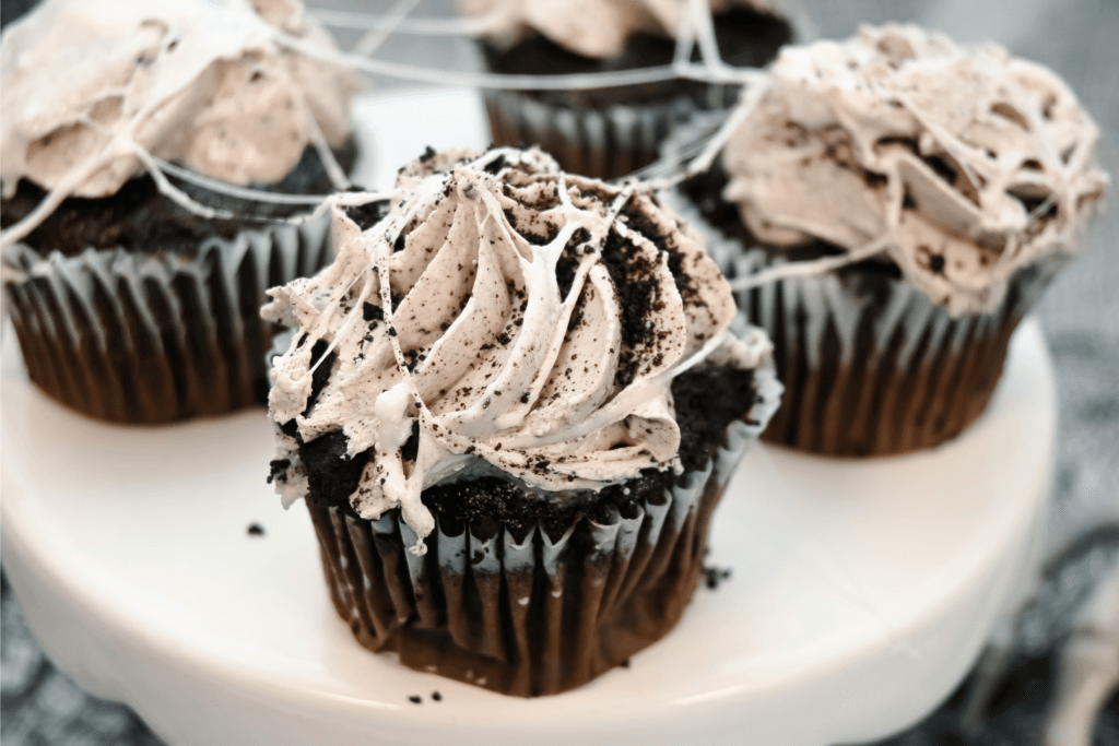 Marshmallows spread on cookies and cream cupcakes
