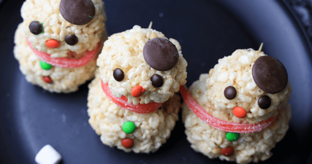 Adding the hat to the snowman rice krispies treats