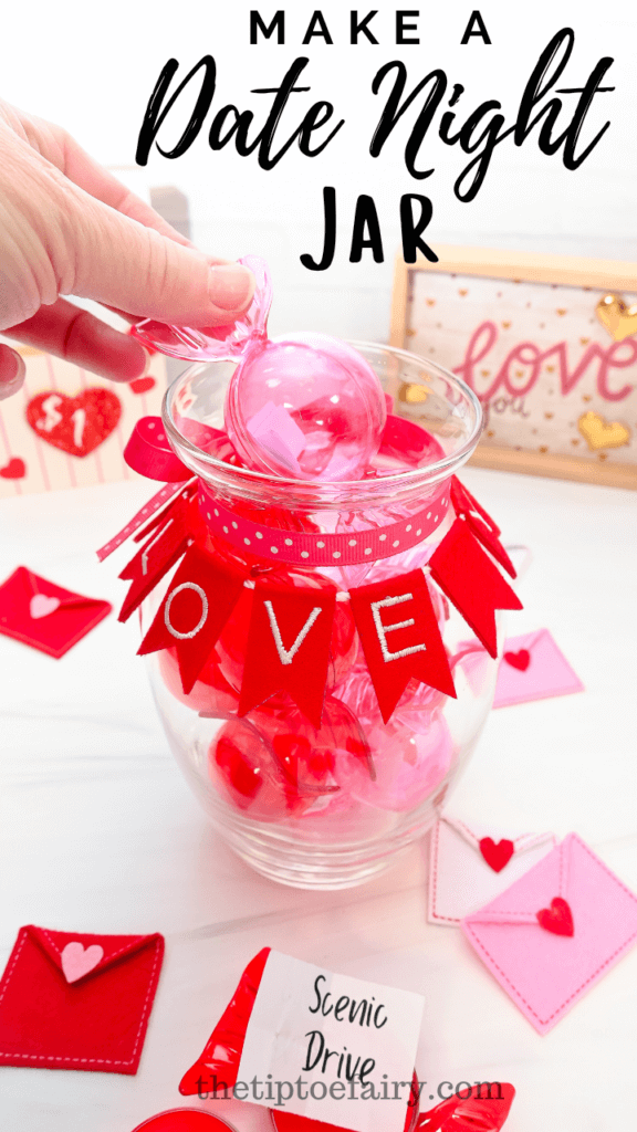 Close up of a woman's hand pulling out a pink plastic candy from a diy date night jar. 