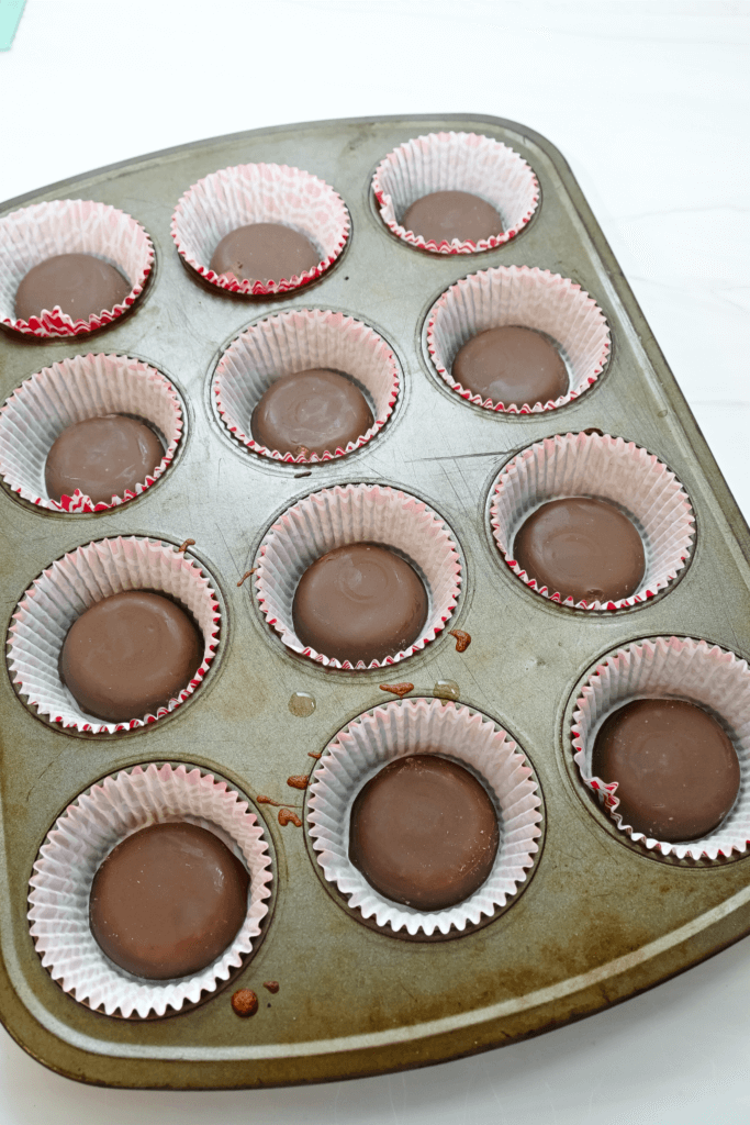 Adding a tagalong to the cupcake liners