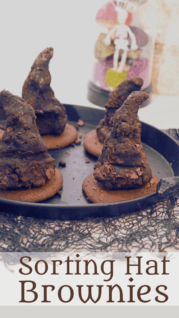 A title image with a creepy cloth, a black platter holding the sorting hat brownies, and a Halloween skeleton cloche in the background.