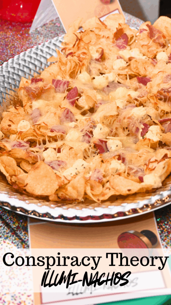 A title image with a silver platter full of charcuterie nachos made for a conspiracy theory party as Illumi-nachos for the illuminati