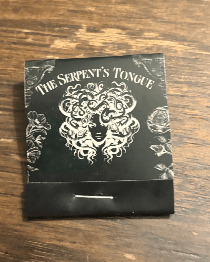 Tucking the front of the cover into the stapled part of the matchbook.